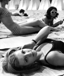 Three young women meet up at the beach for a relaxing time during their summer break